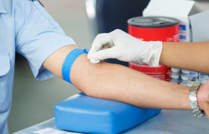 Nurse collecting a blood from a patient
