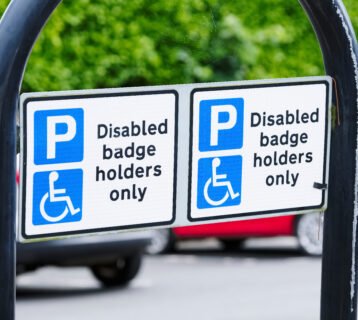 Disabled blue badge holder parking sign for driver