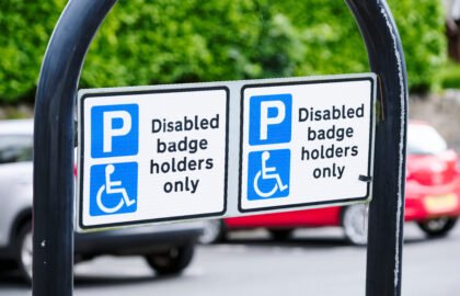 Disabled blue badge holder parking sign for driver